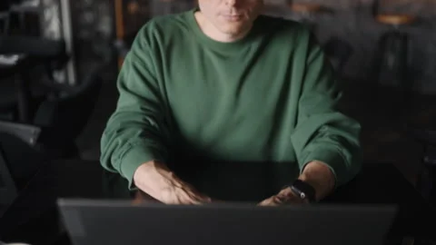 Freelancer Working Remotely With Laptop In Cafe, View From Closeup To Portrait Stock Footage 245912817