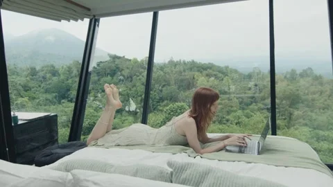 Freelancer working remotely from tiny house in nature Stock Footage 305356499