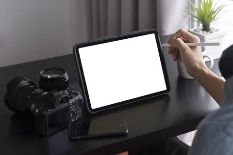 Freelancer working with tablet pc and stylus pen on white screen Stock Photos