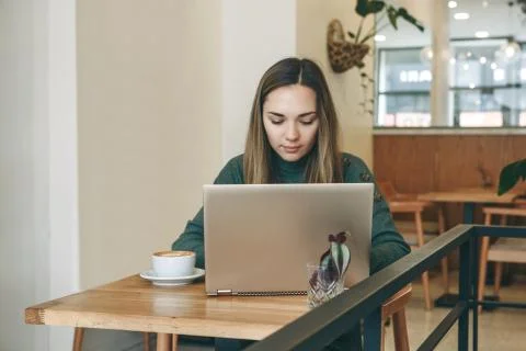 Freelancer works in a cafe Stock Photos