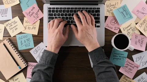 Freelancer works on a desktop computer, top view 스톡 동영상 129236334