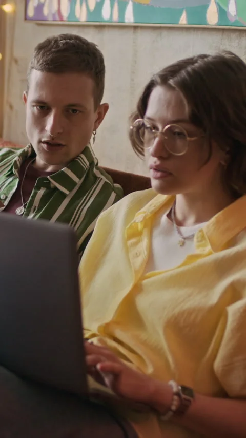 Freelancers Examining Task on Laptop while Working from Home Stock Footage 334797335