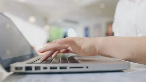 Freelancers often choose to work in coffee shops . With their laptops open an Stock Footage 241464765
