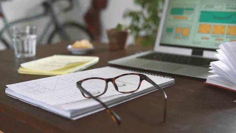 Freelancer's workplace. Web Developer makes sketches of the site in his notebook Video stock 88170770