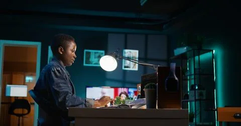 Freelancing admin in home office using laptop to write programming language code Stockfoto's