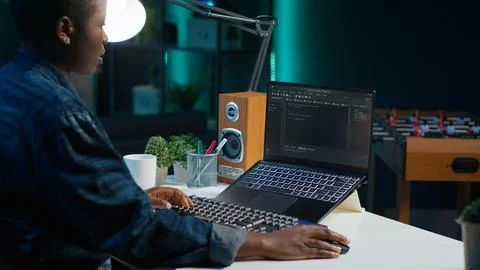 Freelancing admin in home office using laptop to write programming language code Stockfoto's