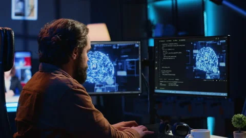 Freelancing IT specialist writing AI code, training machine learning Stock Footage 265619491