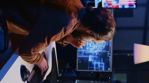 Freelancing programmer writes artificial intelligence code on desktop PC Stock Footage 265107434