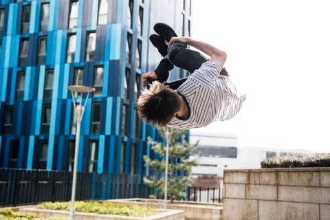 Freerunner Doing Flips in the City 库存照片