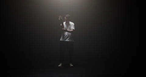 Freestyle dancer performing in spotlight Stock Footage 244525360