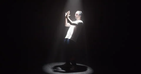 Freestyle dancer performing in spotlight Stock Footage 244526146