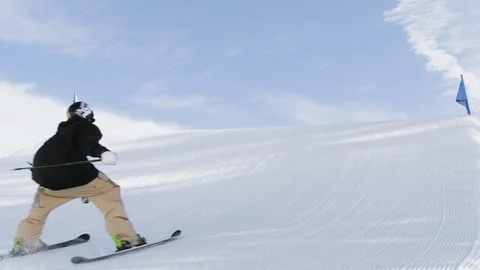 Freestyle skier jumping and spinning off of a jump in the terrain park Stock Footage 113201835
