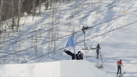 Freestyle skier jumping high off of ski jump in the terrain park Stock Footage 113202479