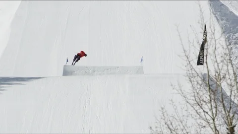 Freestyle skier jumping high off of ski jump in the terrain park Stock Footage 113202571