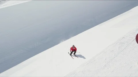 Freestyle skier jumping out of a halfpipe and performing a 360 close to camera Stock Footage 113205534