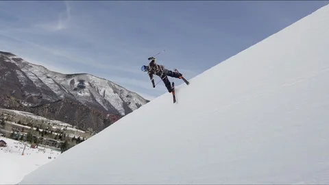 Freestyle skier landing a 720 off of a halfpipe Stock Footage 113199186