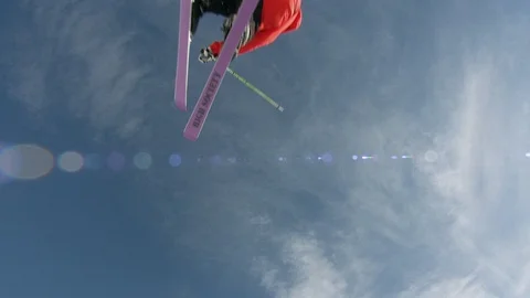 Freestyle skier performing a backflip off of a jump in the terrain park Stock Footage 113202279
