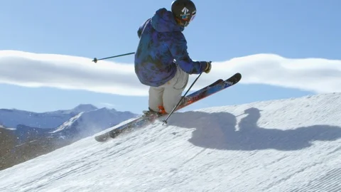 Freestyle skier performing a lincoln loop off of a jump Stock Footage 113264128