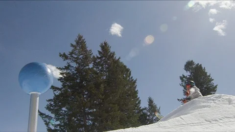 Freestyle snowboarder jumping high over obstacle in the terrain park Stock Footage 113201285