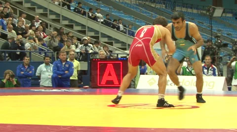 Freestyle wrestler rolls another wrestler 03 Stock Footage 44218609