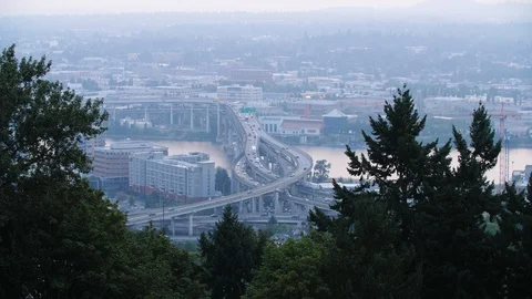Freeway city traffic going over Willamette River bridges in Portland Oregon Stock Footage 104455638