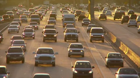 Freeway at dusk with oncoming L.A. traffic Stock-Footage 8839749