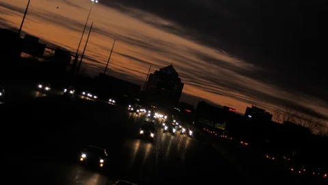 Freeway at dusk with oncoming rush hour traffic Stock Footage 126999819