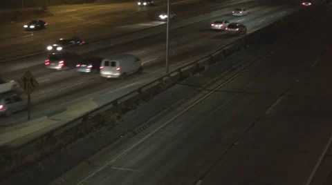 Freeway highway night light illuminated car traffic street road lane people USA Video stock 37362012