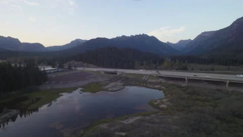 Freeway in the mountains with two way traffic driving by Stock-Footage 42945405