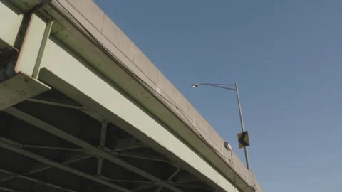 Freeway overpass and a clear sky Stock Footage 264544991