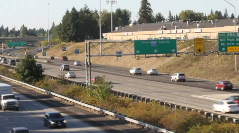 Freeway running both ways with Seattle sign in background Stock Footage 29611649