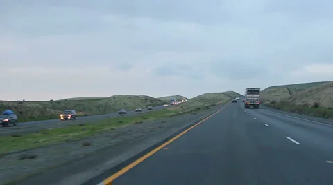 Freeway Sides through Lumpy Mountain Freeway Stock Footage 5766536