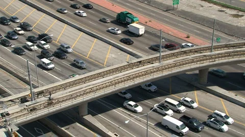 Freeway Traffic and Light Rail Overpass Stock Footage 4280135