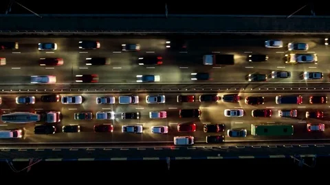 Freeway traffic jam city rush hour. Aerial night view time lapse city traffic Stock Footage
