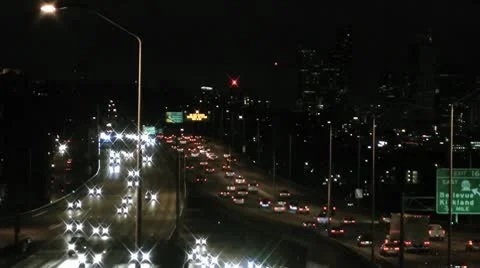 Freeway traffic, night, headlights Stock Footage