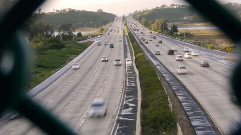 Freeway View From Fence With Audio Stock Footage 1101312