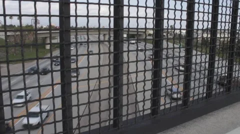 Freeway View through Fence Stock Footage 50232481