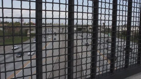 Freeway View through Fence Line 2 Stock Footage 50231843