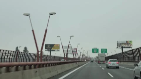 Freeway within the city limits. The flow of cars. Car traffic jams. Stock Footage 220227063