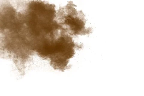 Freeze motion of brown powder exploding. Abstract design of color powder. 库存照片