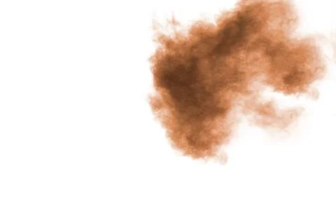 Freeze motion of brown powder exploding. Abstract design of brown dust cloud. 库存照片