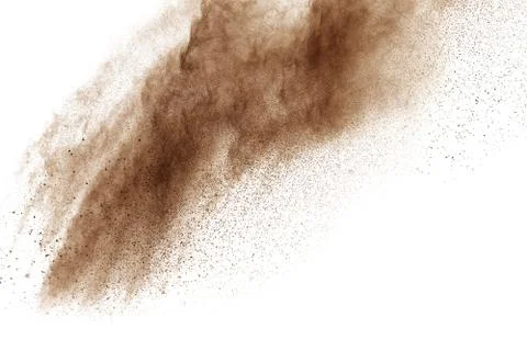Freeze motion of brown powder exploding. Abstract design of brown dust cloud. 库存照片