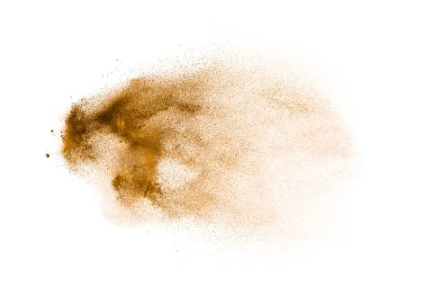 Freeze motion of brown powder exploding. Abstract design of brown dust cloud. 库存照片