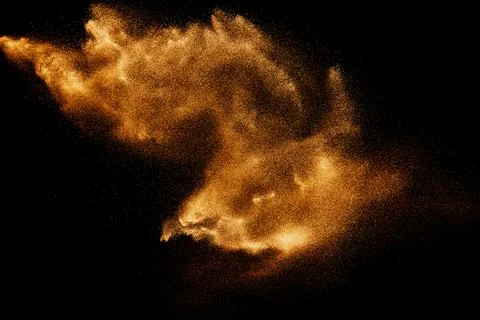 Freeze motion of brown powder exploding. Stock Photos