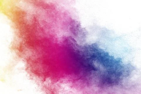 Freeze motion of color powder exploding on white background Stock Photos