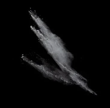 Freeze motion of colored dust explosion isolated on black background 写真素材