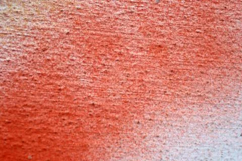 Freeze motion of red powder exploding, isolated on white background. Abstract Stock Photos