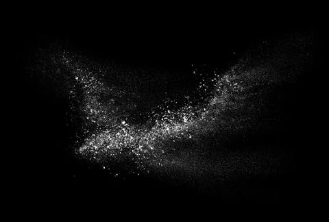 Freeze motion of white powder exploding, isolated on black background. Stock Photos