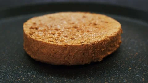 Freezer burger cutlet fried in a pan, Vegetable food to replace animal meat Stock Footage 167937441