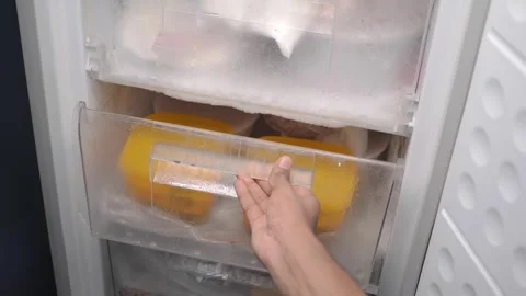 Freezer storage with ice buildup and food containers inside Stock Footage 339827231